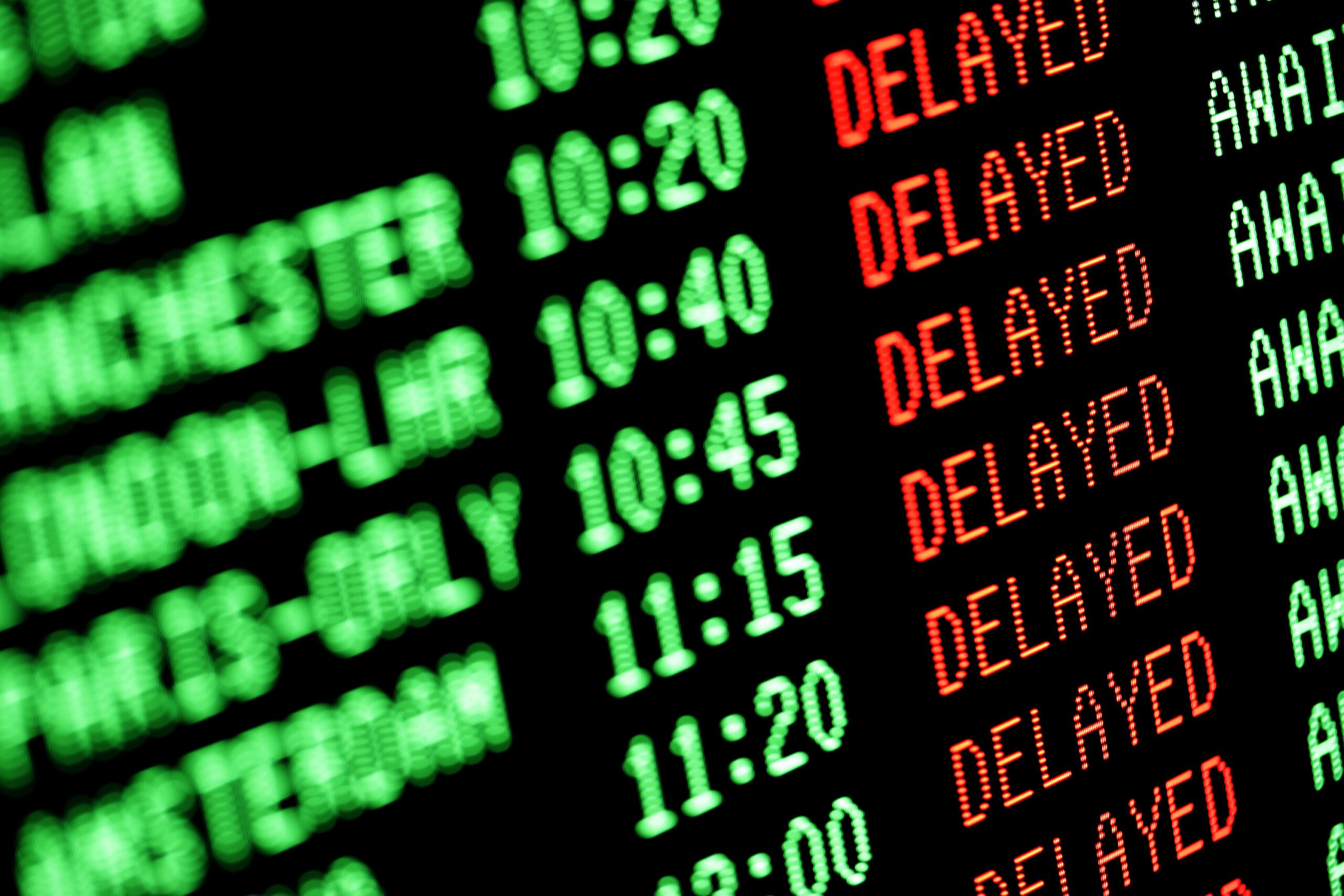 Airline departure screen showing flight delays